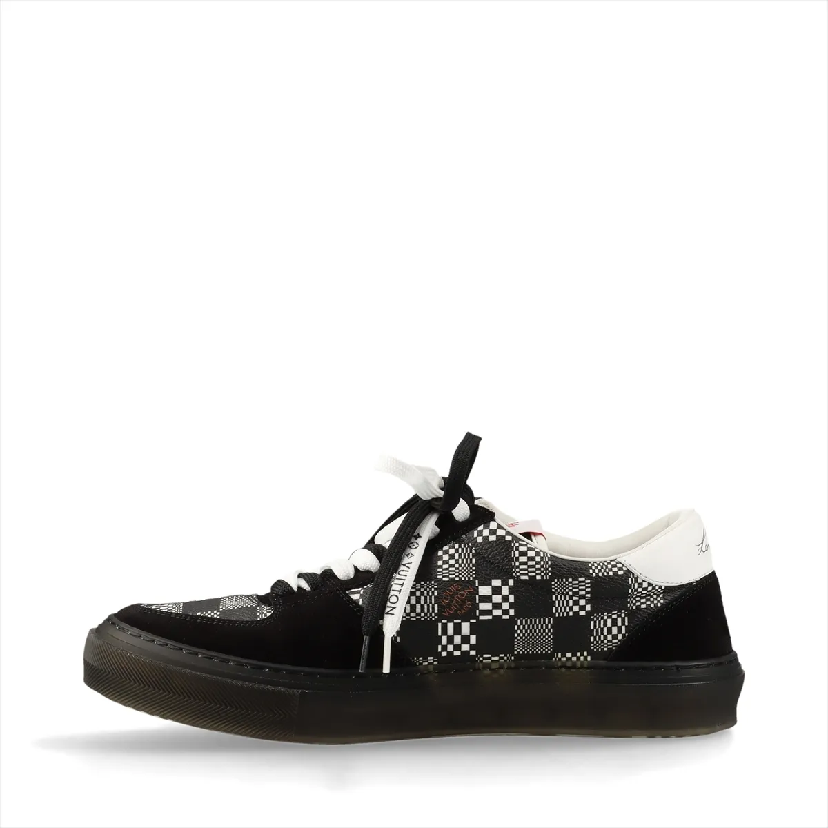 Black and white low-top sneakers with patterned panel detailing.