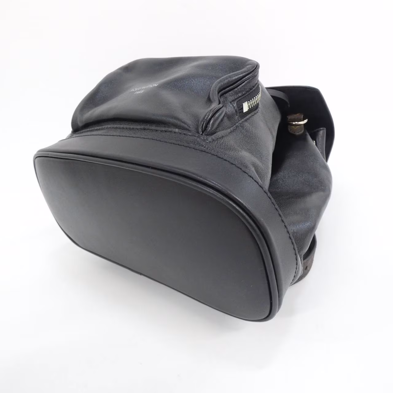 Monogram-patterned backpack with a fluffy textured finish and twin shoulder straps.