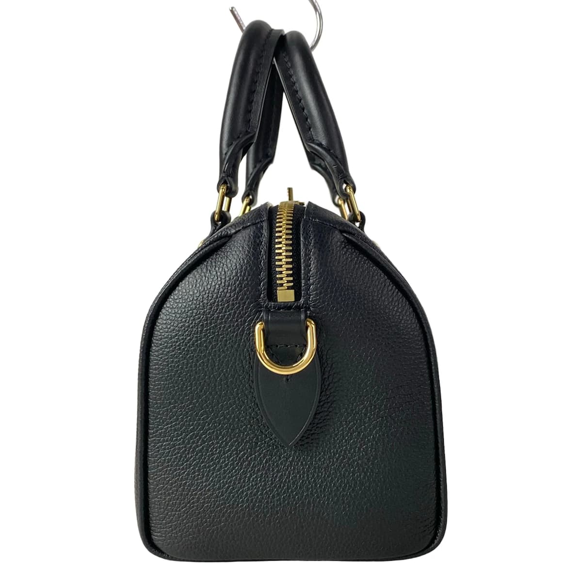 Embossed monogram leather handbag with top handles and a structured body.