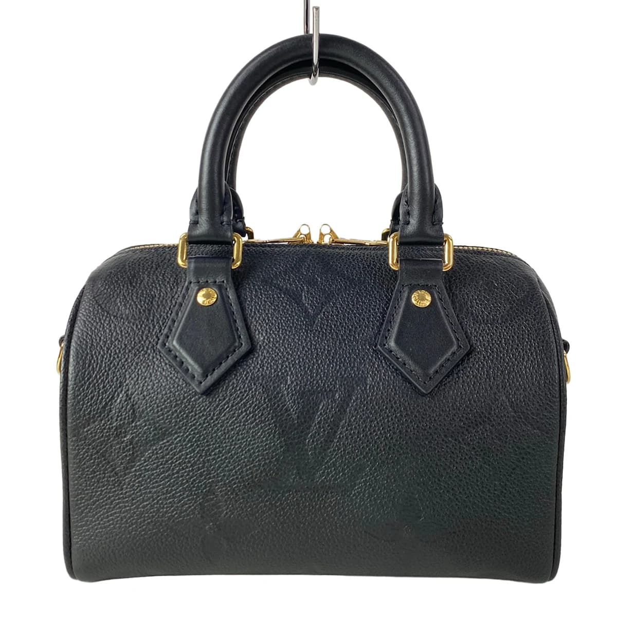 Embossed monogram leather handbag with top handles and a structured body.