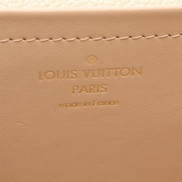 Cream embossed-leather shoulder bag with flap front and gold-tone hardware.