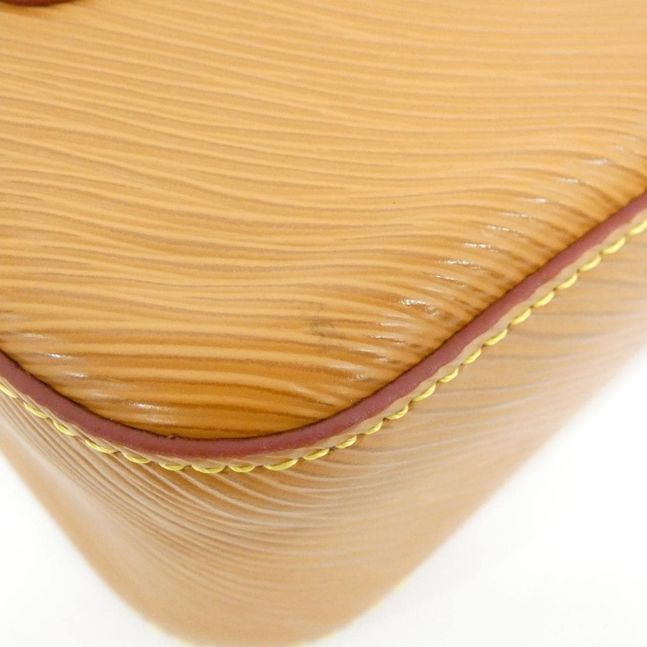 Textured black leather flap bag with silver-tone clasp and a slim shoulder strap.