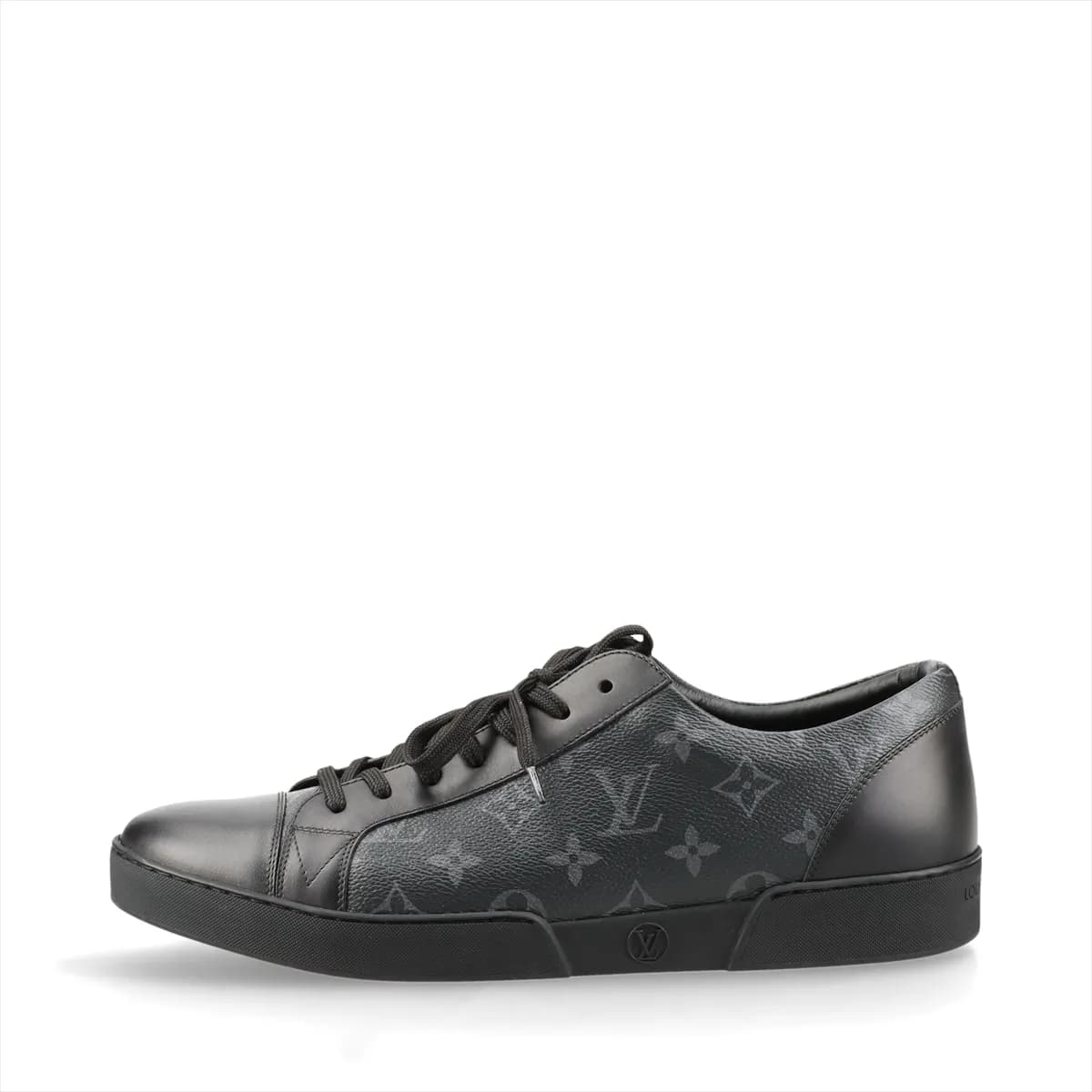 Black monogram-patterned low-top footwear with leather panels and a white sole