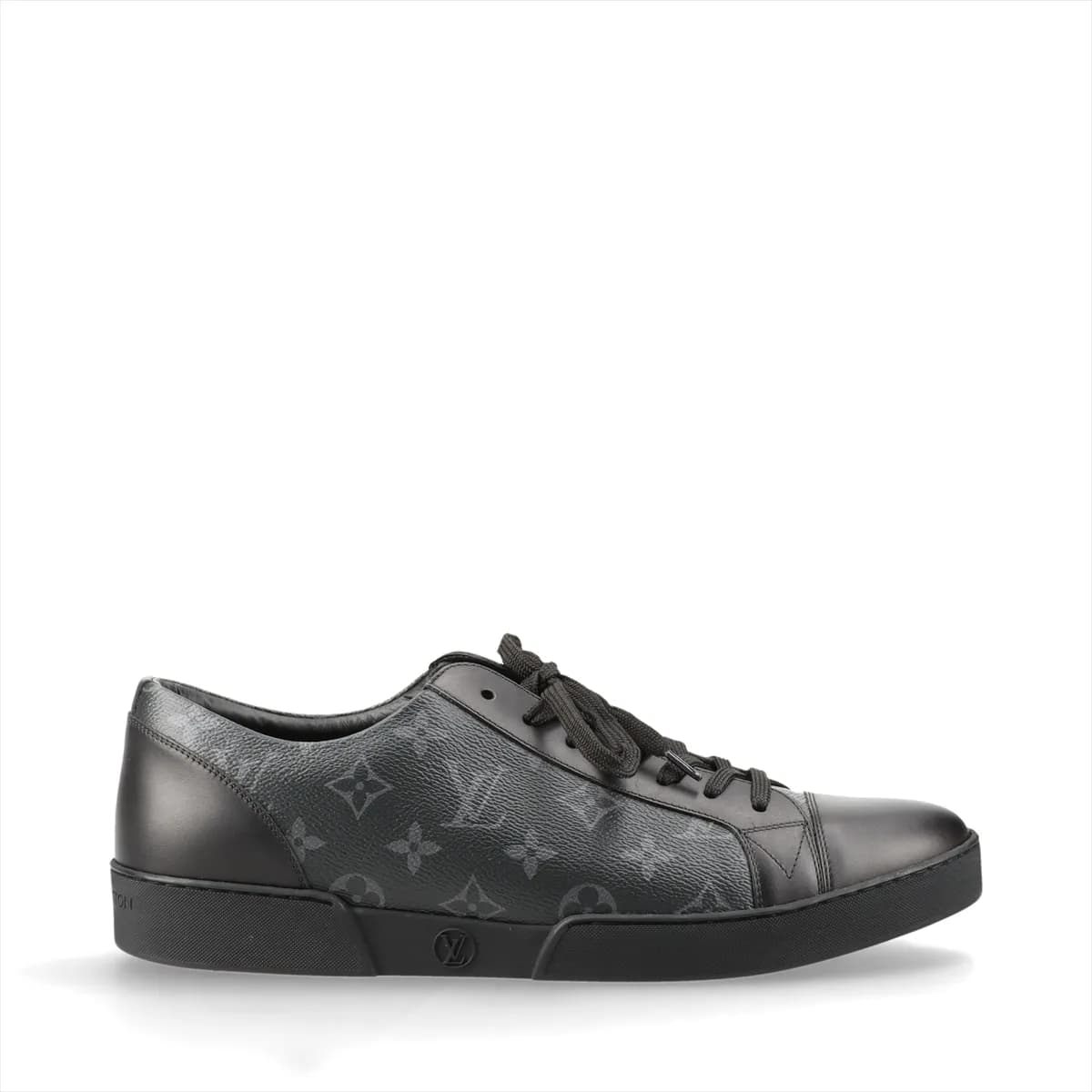 Black monogram-patterned low-top footwear with leather panels and a white sole