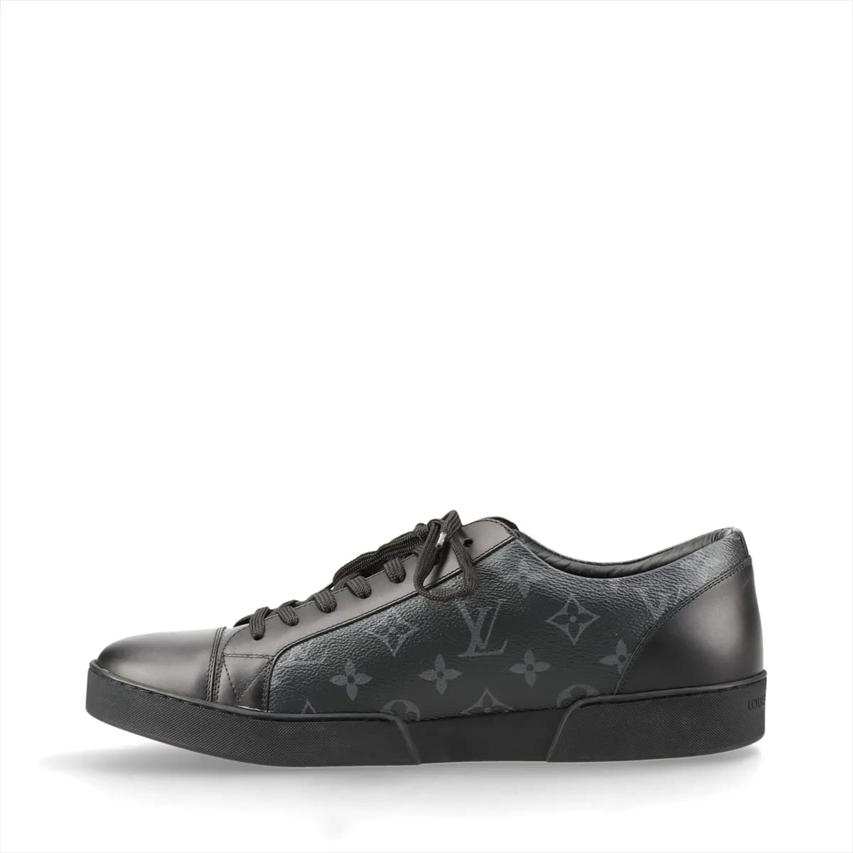 Black monogram-patterned low-top footwear with leather panels and a white sole