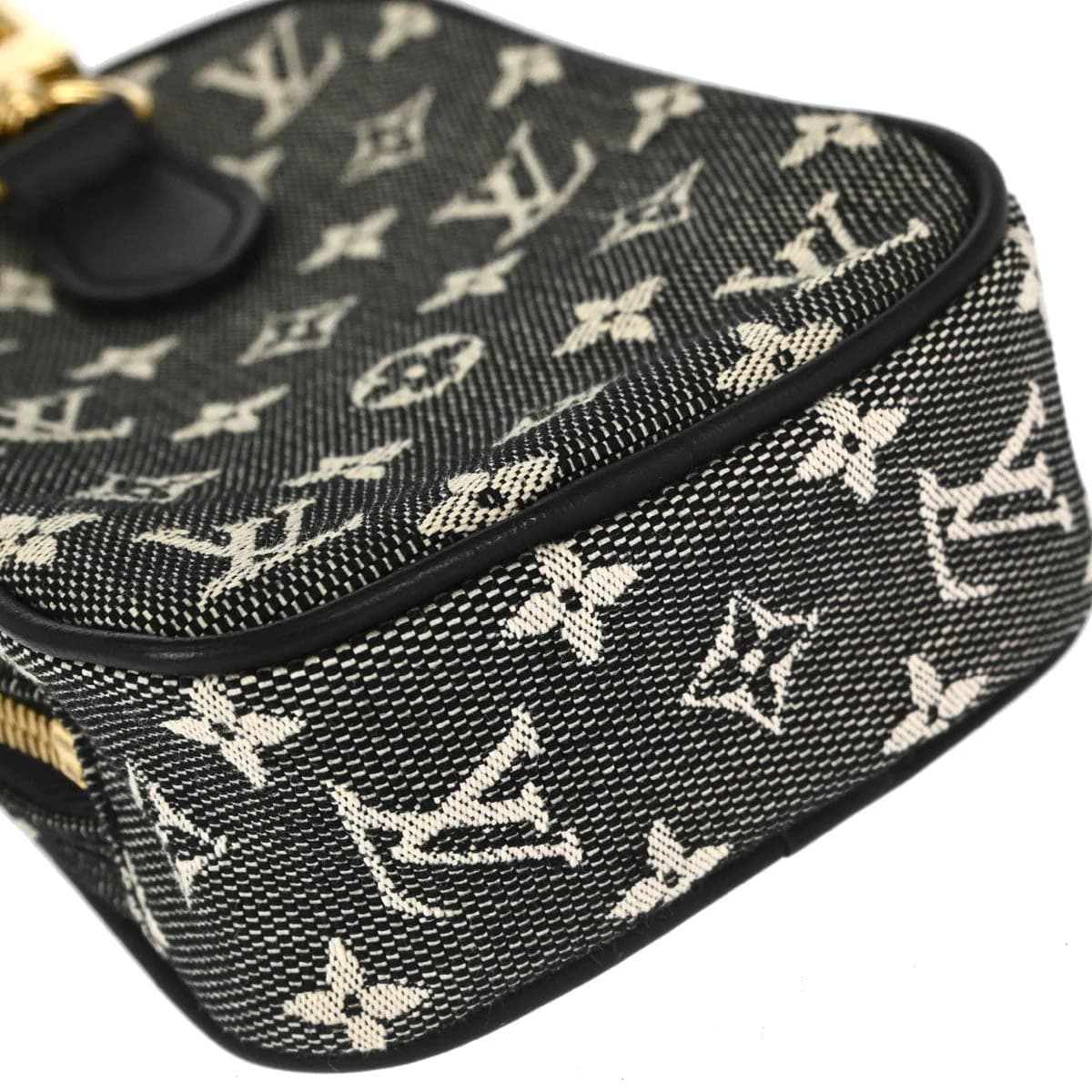 Black monogram-patterned fabric shoulder bag with leather trim and a single strap.