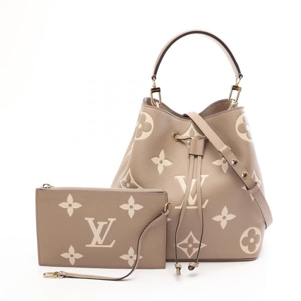 Product photograph of a two-tone bucket bag with drawstring sides and a shoulder strap.