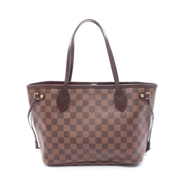 Brown checkered canvas open tote with long leather straps, standing upright.