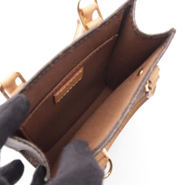 Product photograph of a very small rectangular monogram-canvas tote with top handles.