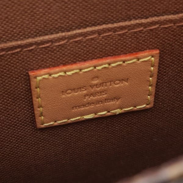 Product photograph of a very small rectangular monogram-canvas tote with top handles.