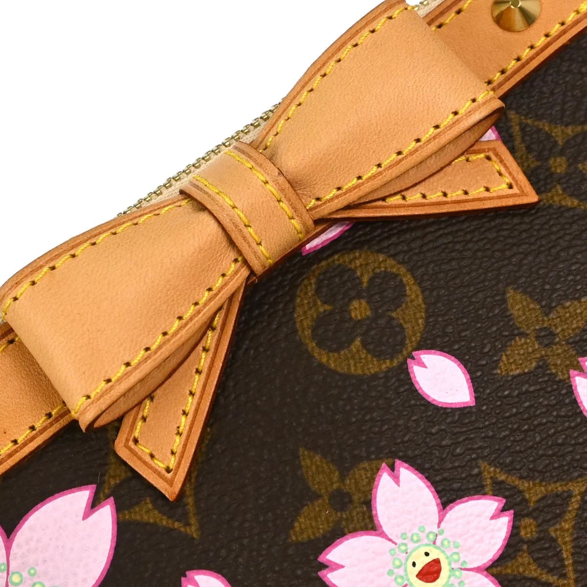Small brown monogram canvas pouch printed with pink and cream flowers, with a short strap