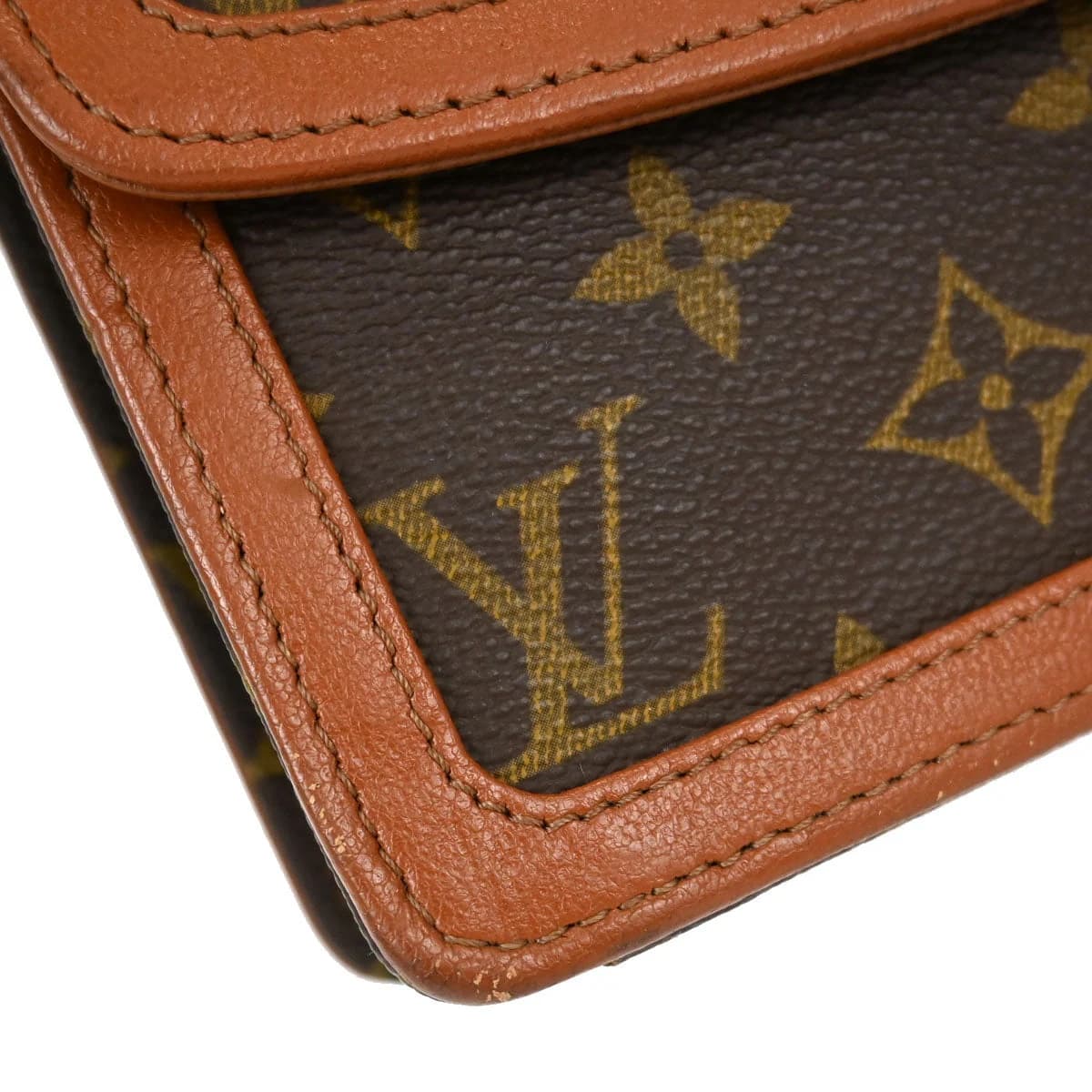 Flat brown monogram-patterned canvas clutch with leather trim.