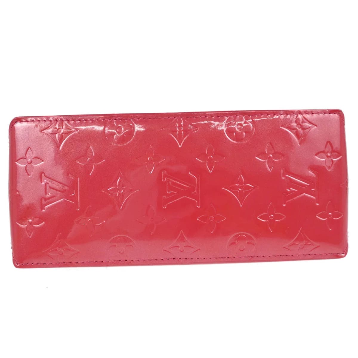 Compact glossy pink patent handbag with embossed monogram pattern and two short handles.