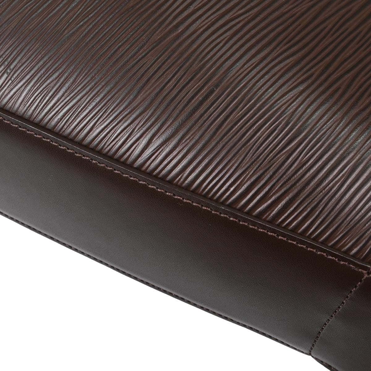 Brown textured leather shoulder bag with a slim strap and a flap front.