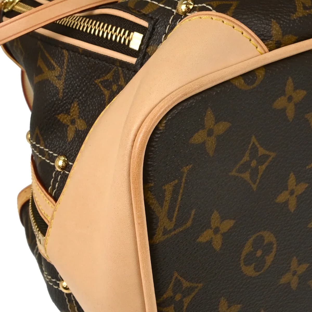 Brown monogram canvas handbag with rolled leather handles and front pockets.