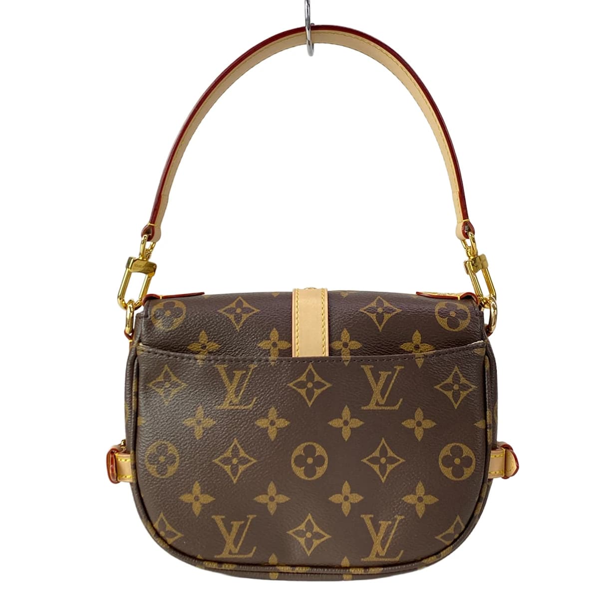 Small monogram-canvas saddle-style bag with a buckled flap and shoulder strap.