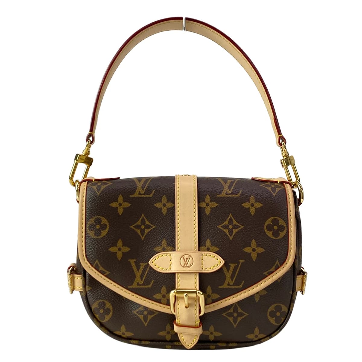Small monogram-canvas saddle-style bag with a buckled flap and shoulder strap.