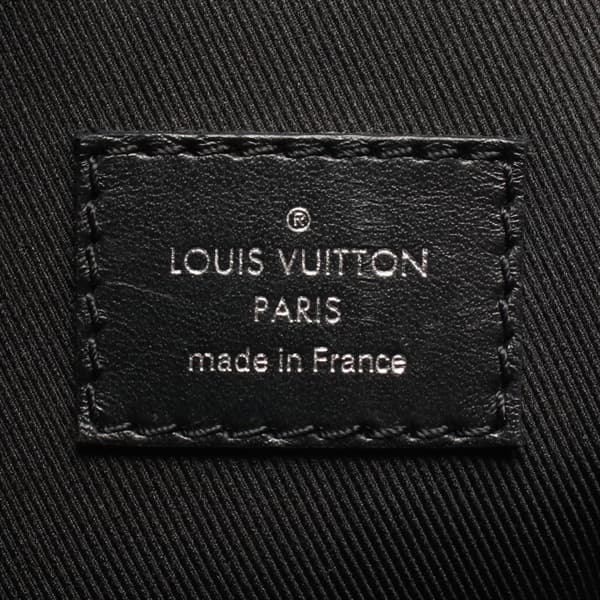 Rigid rectangular black bag with tonal monogram pattern and a wide strap.