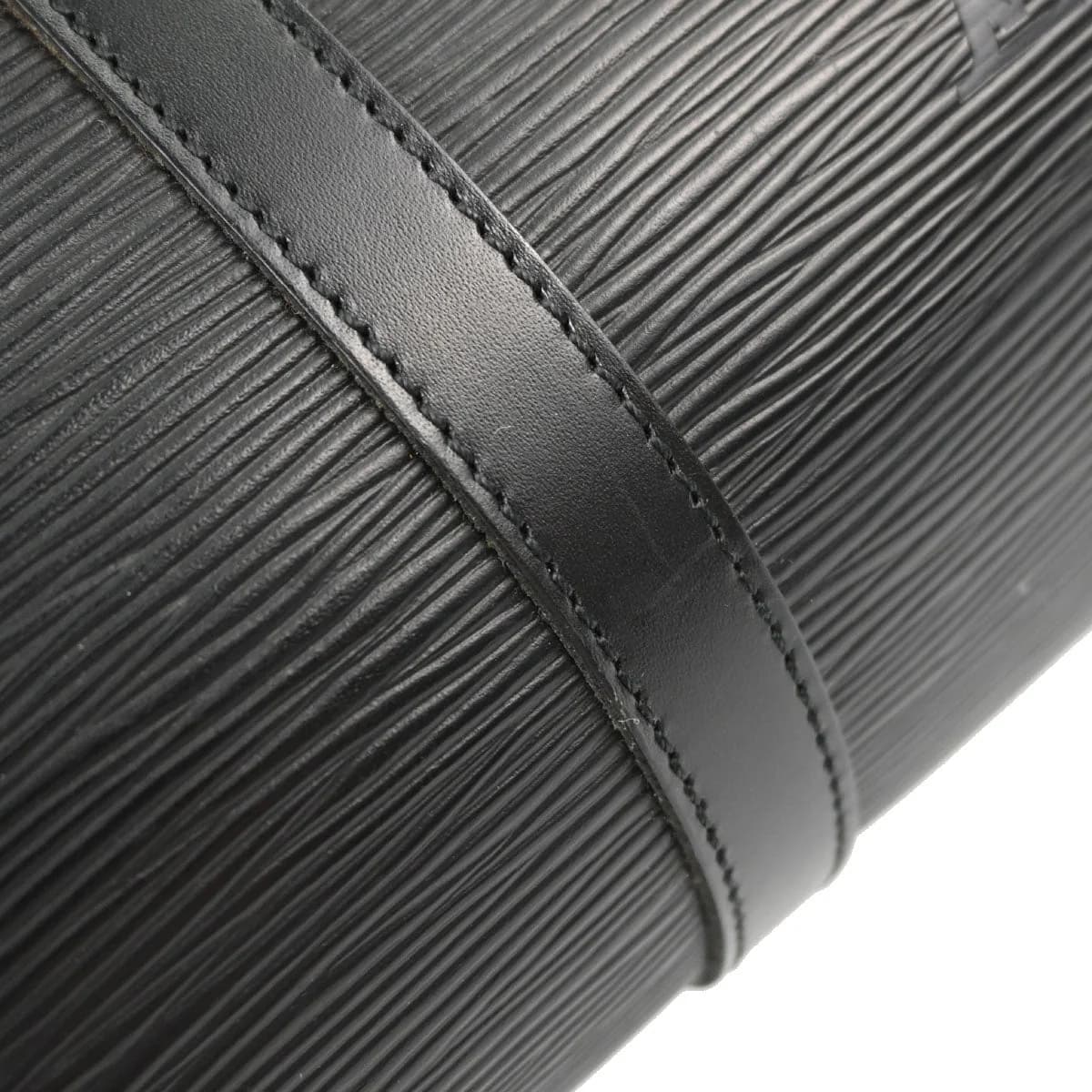 Black textured leather handbag with two rolled handles and gold-tone hardware.