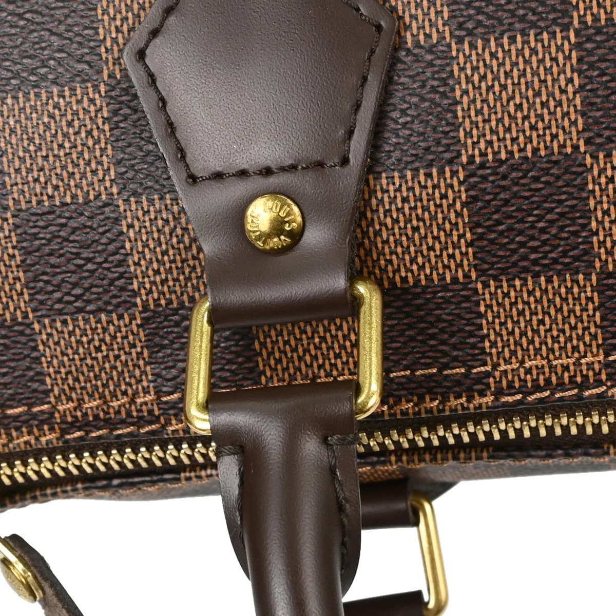 Rounded brown checked canvas handbag with two rolled handles and a zip top.