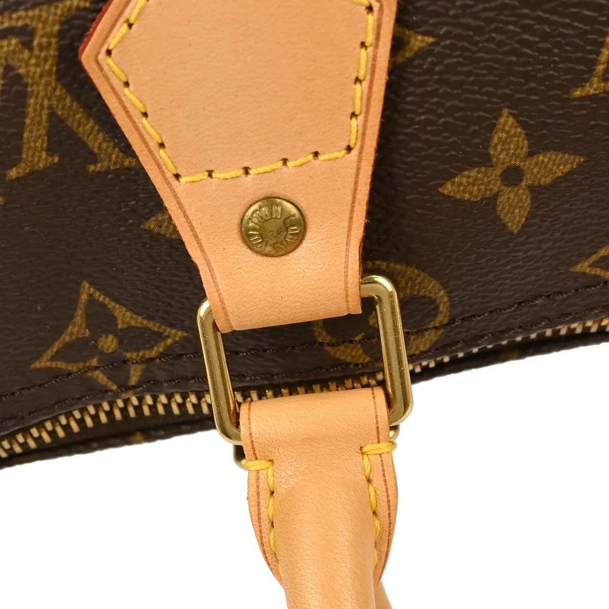 Rounded brown monogram canvas handbag with two short handles and a top zip.
