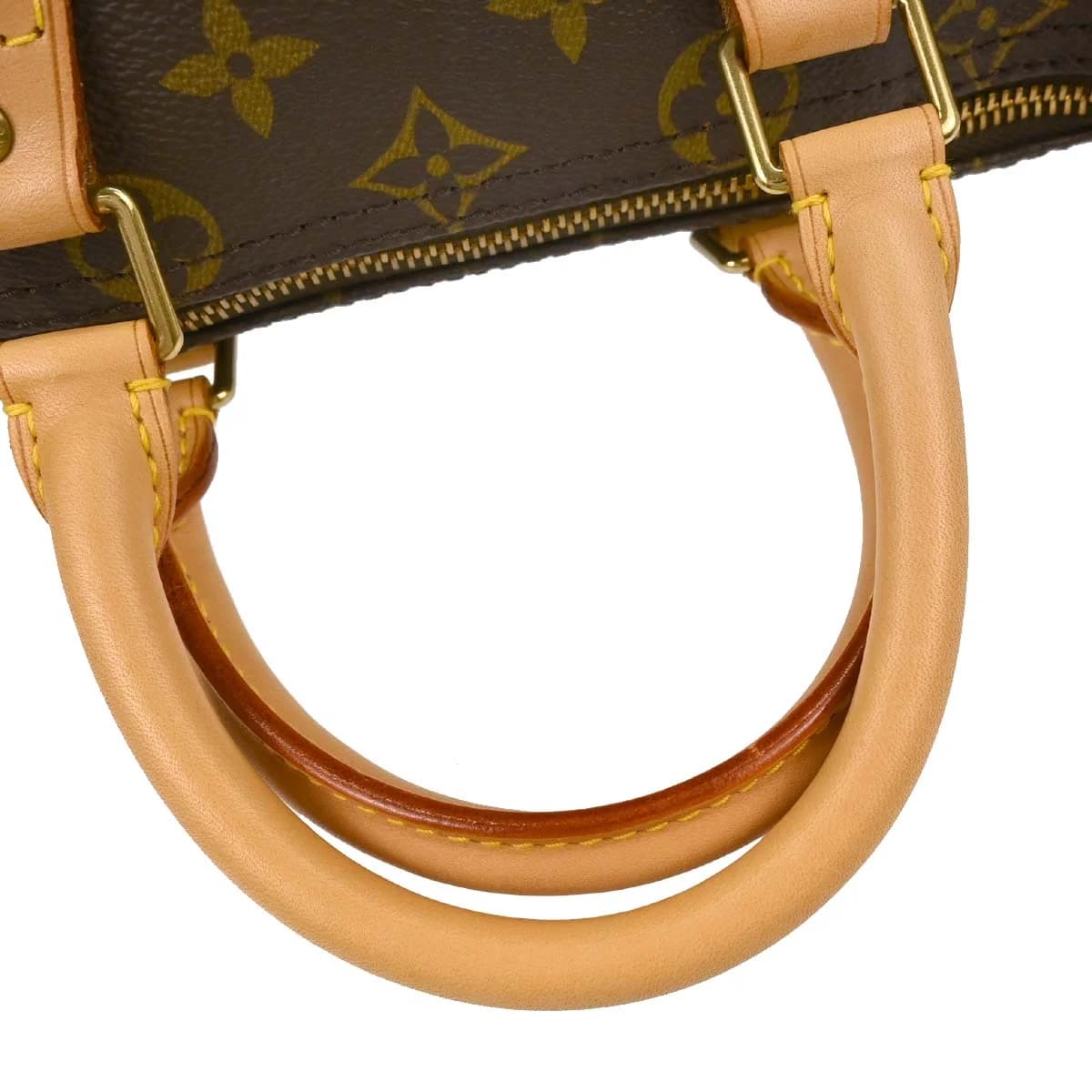 Rounded brown monogram canvas handbag with two short handles and a top zip.