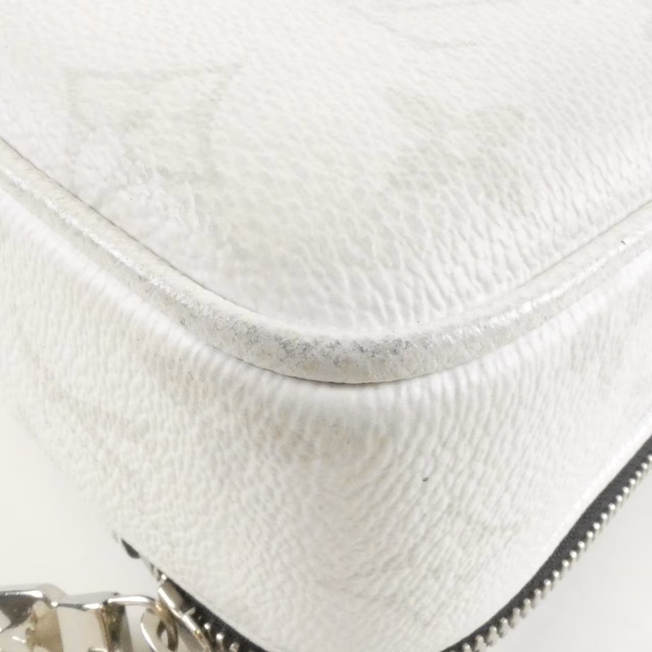Flat grained leather messenger bag with flap front and long adjustable strap.