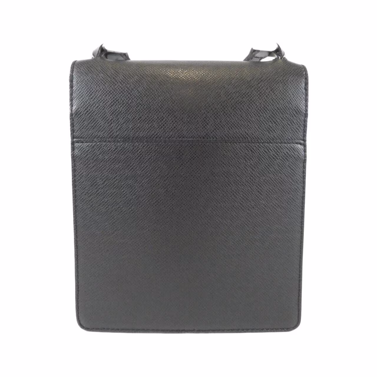 Compact grained leather shoulder bag with slim strap and zip closure.