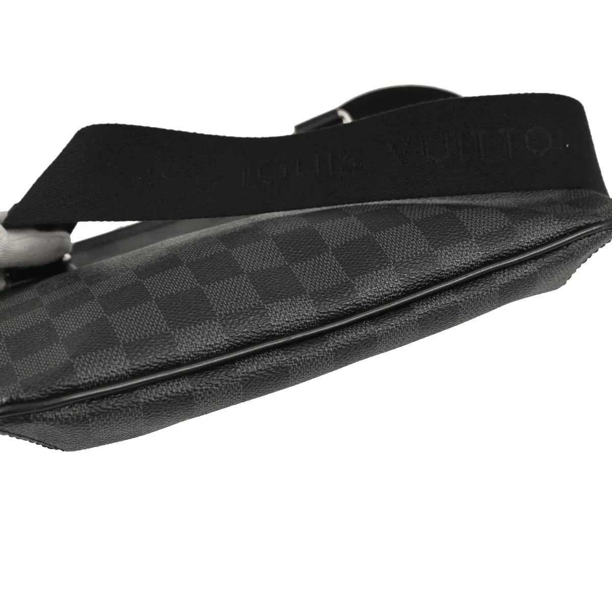 Small black and grey checked canvas crossbody bag with a long adjustable strap.