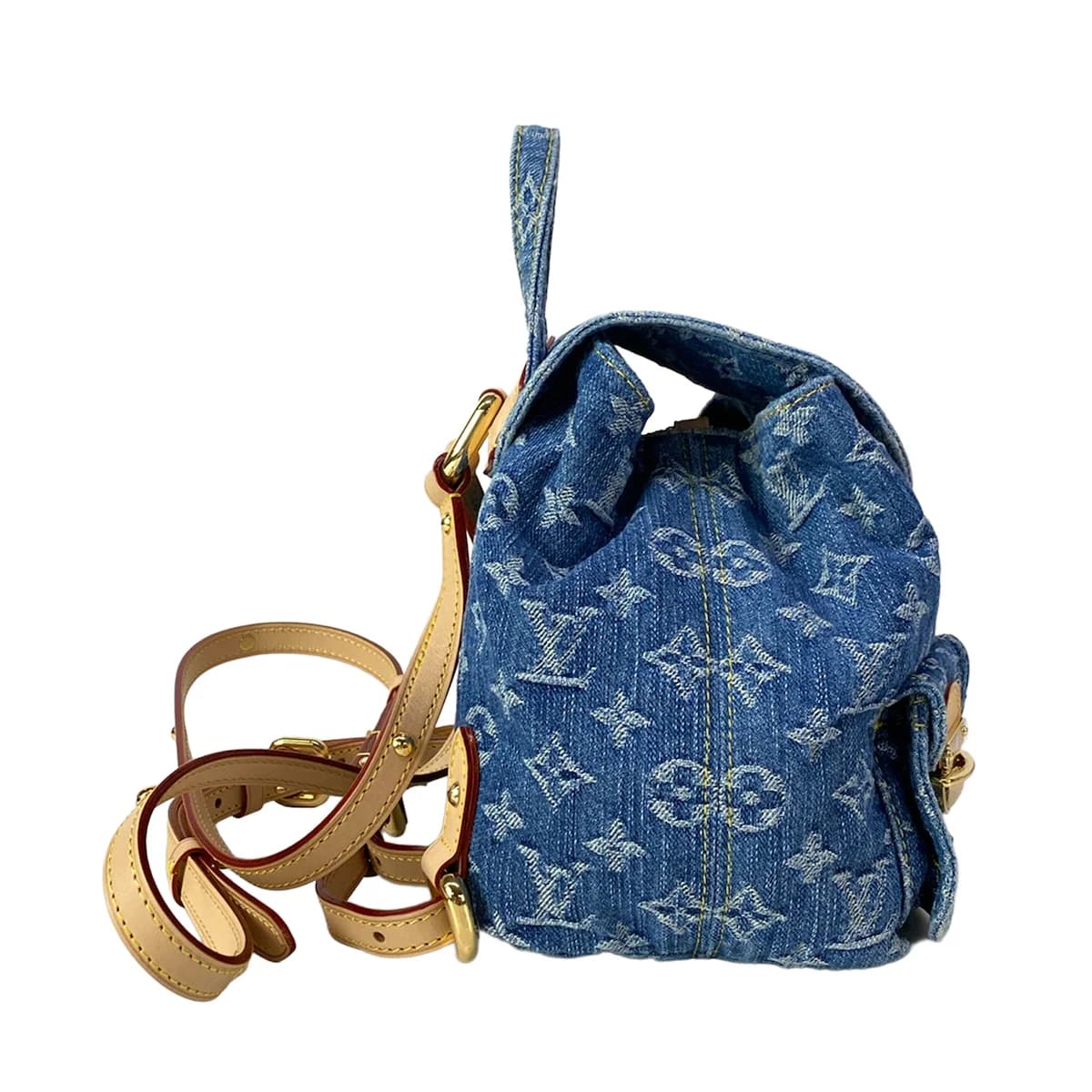 Denim backpack with woven monogram pattern, leather trim and two shoulder straps.