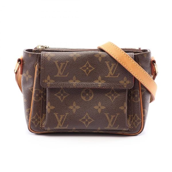 Small brown monogram shoulder bag with curved top and single strap.