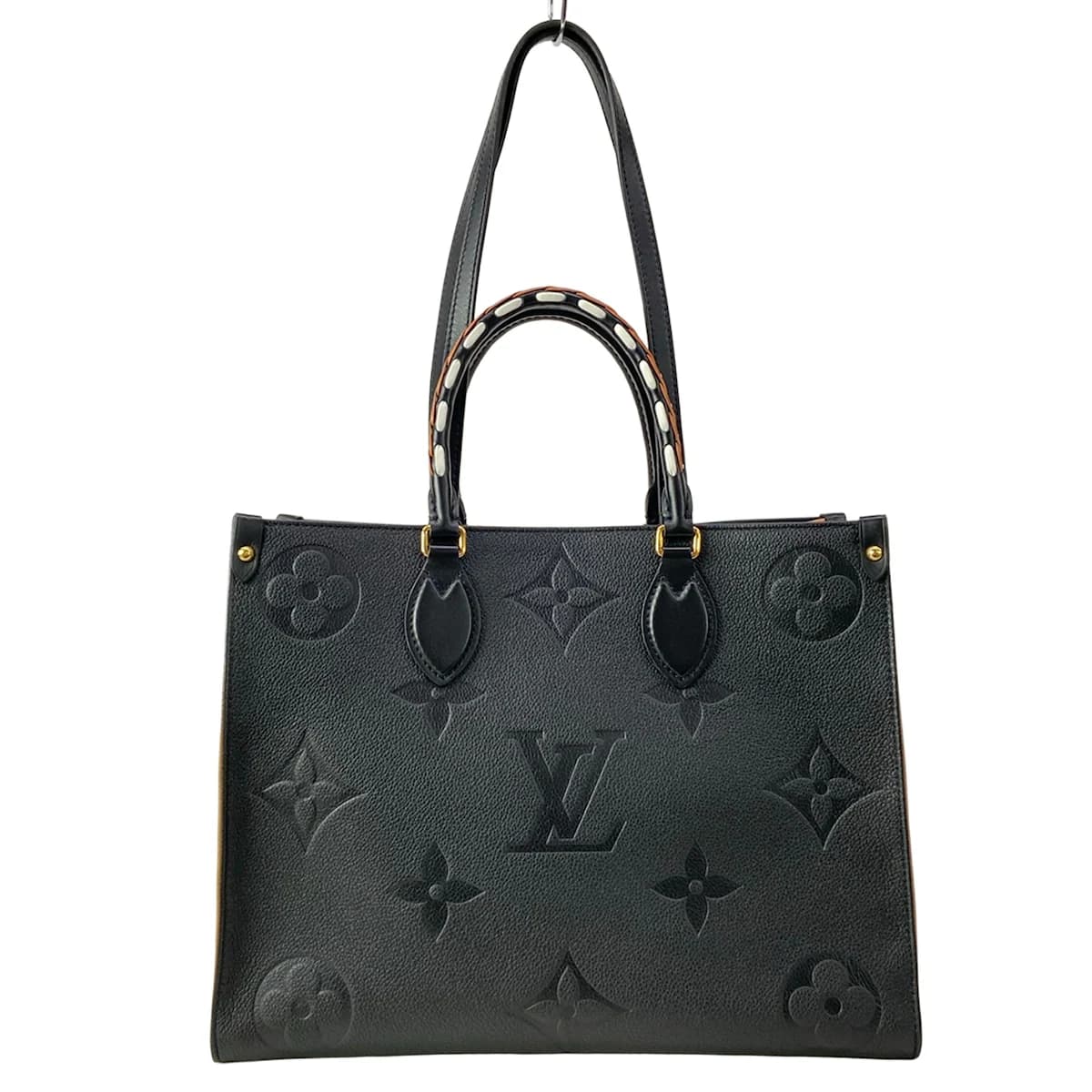 Large two-tone patterned tote with twin top handles and an open top.