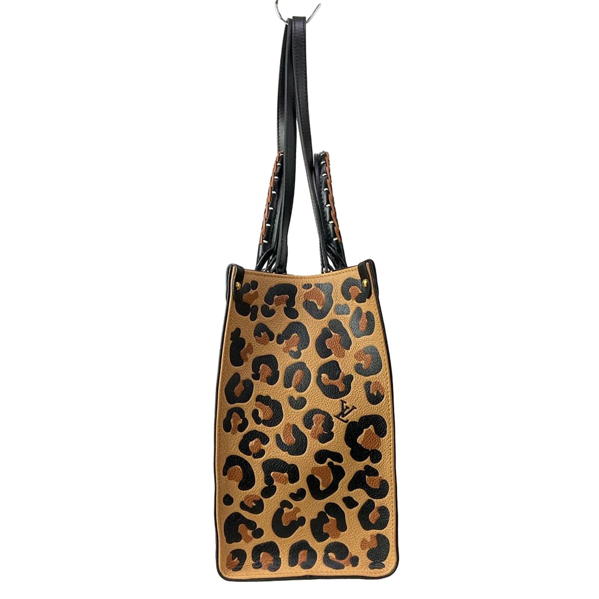 Large two-tone patterned tote with twin top handles and an open top.