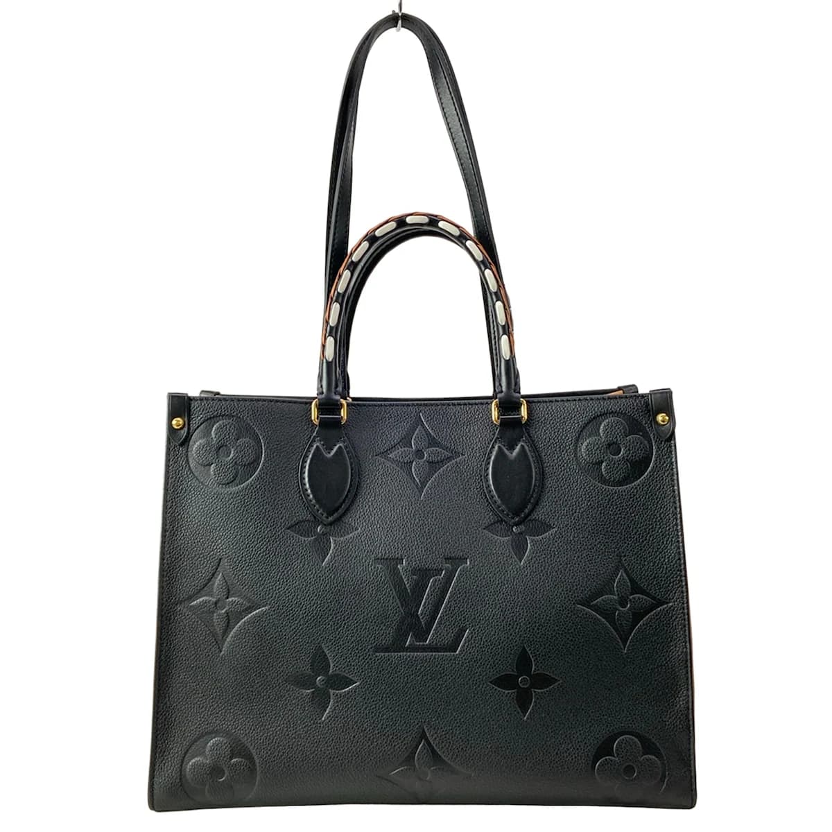 Large two-tone patterned tote with twin top handles and an open top.