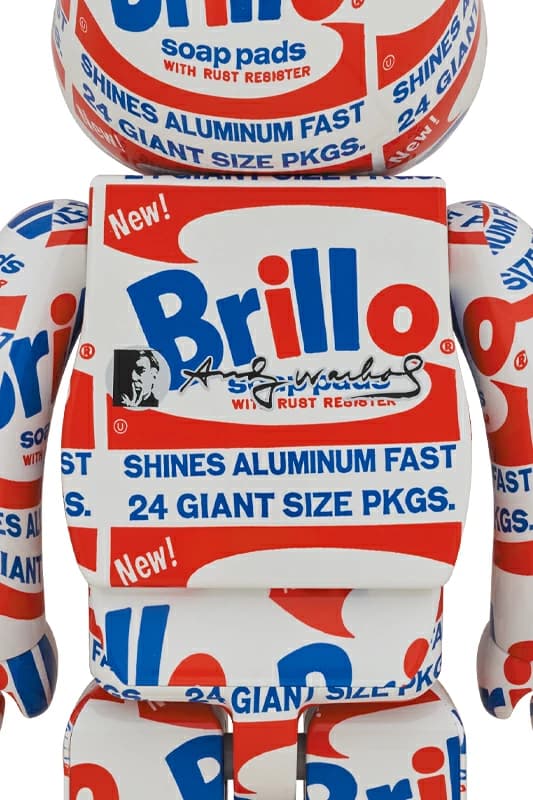 Product photograph of a large bear-shaped figure printed with red, white and blue packaging-style graphics.