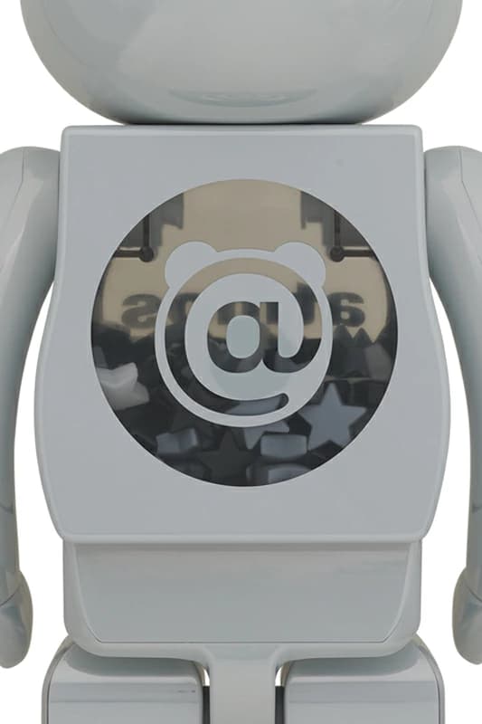 Tall bear-shaped figure with a reflective white chrome surface.