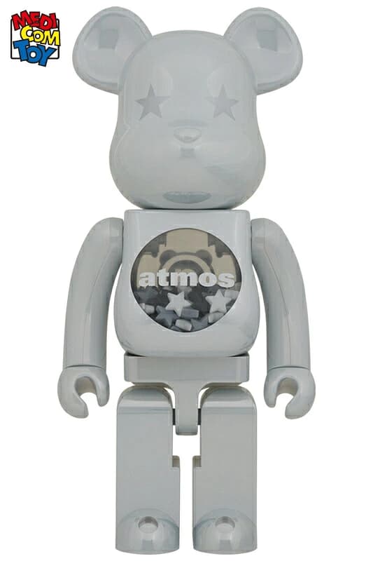 Tall bear-shaped figure with a reflective white chrome surface.