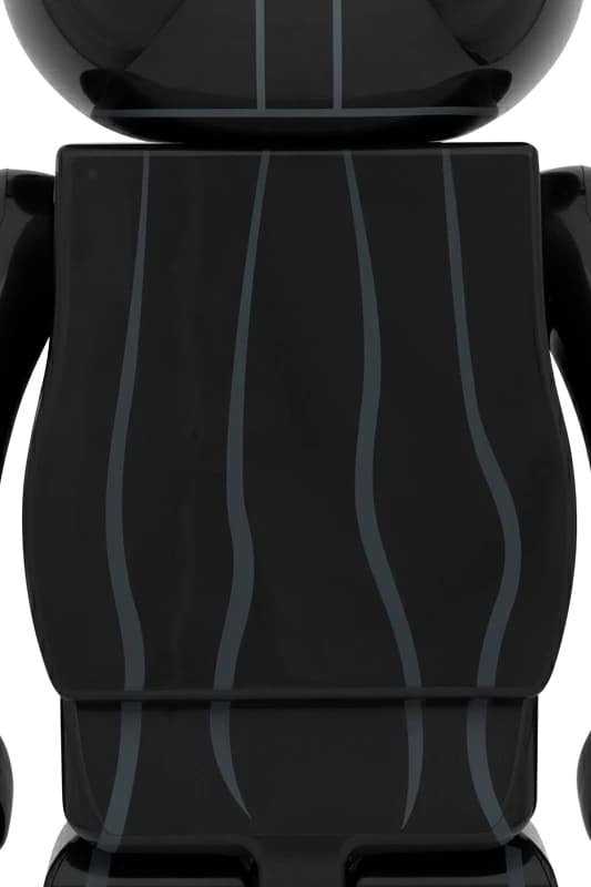 Large black bear-shaped collectible figure with a damaged helmet design and chest panel detail