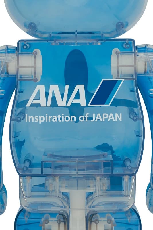 Large bear-shaped collectible figure in blue and white with aircraft-themed graphics.