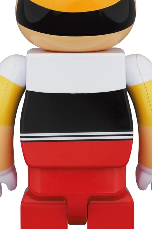 Large bear-shaped collectible figure decorated as a puppet boy character with hat and bow tie