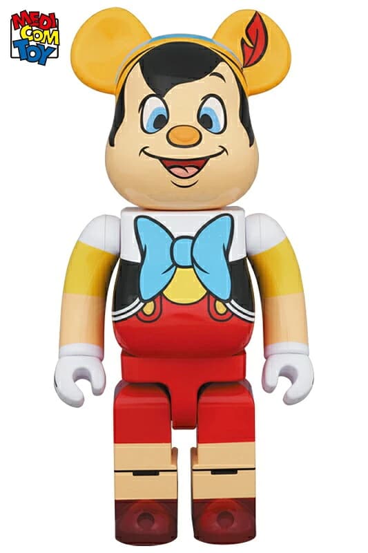 Large bear-shaped collectible figure decorated as a puppet boy character with hat and bow tie