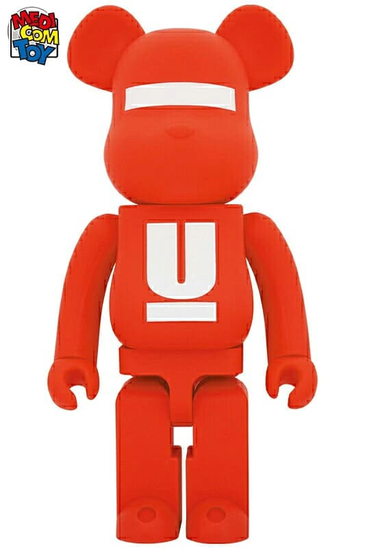 Large red bear-shaped collectible figure with logo graphics across the chest.