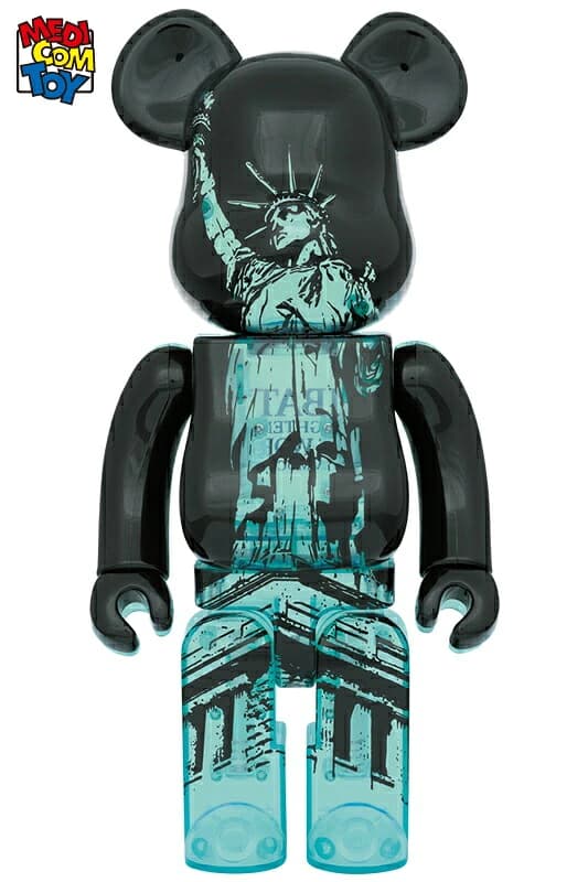 Large bear-shaped collectible figure in a pale green finish with crown and torch details