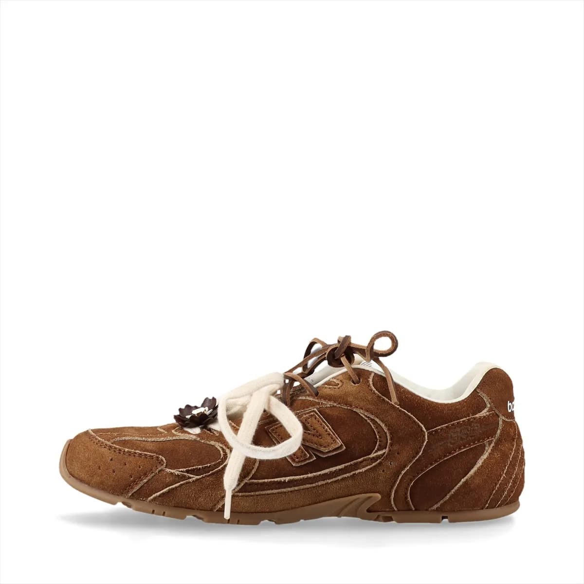 Brown suede low-top sneakers with a worn-look finish and pale gum-tone sole.