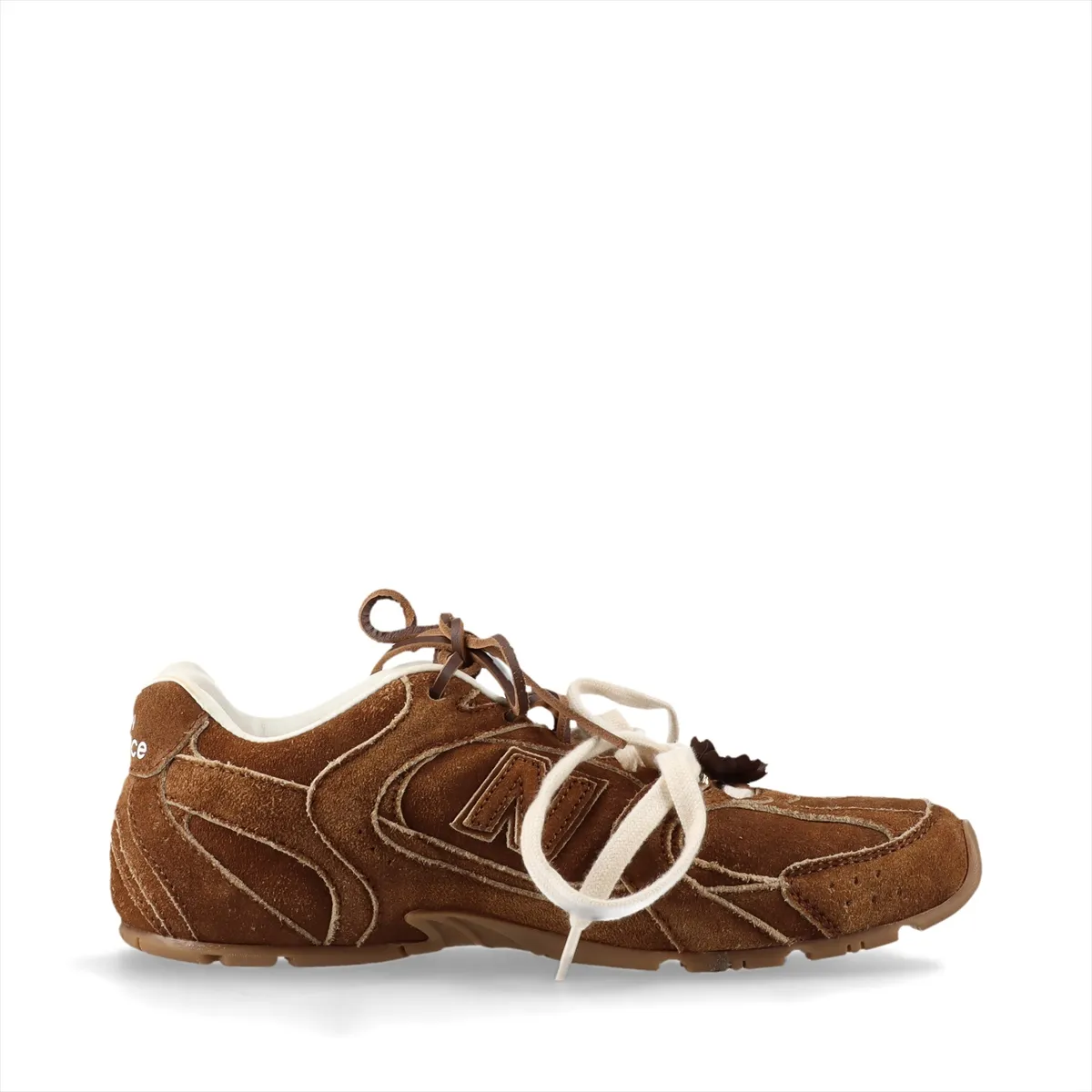 Brown suede low-top sneakers with a worn-look finish and pale gum-tone sole.