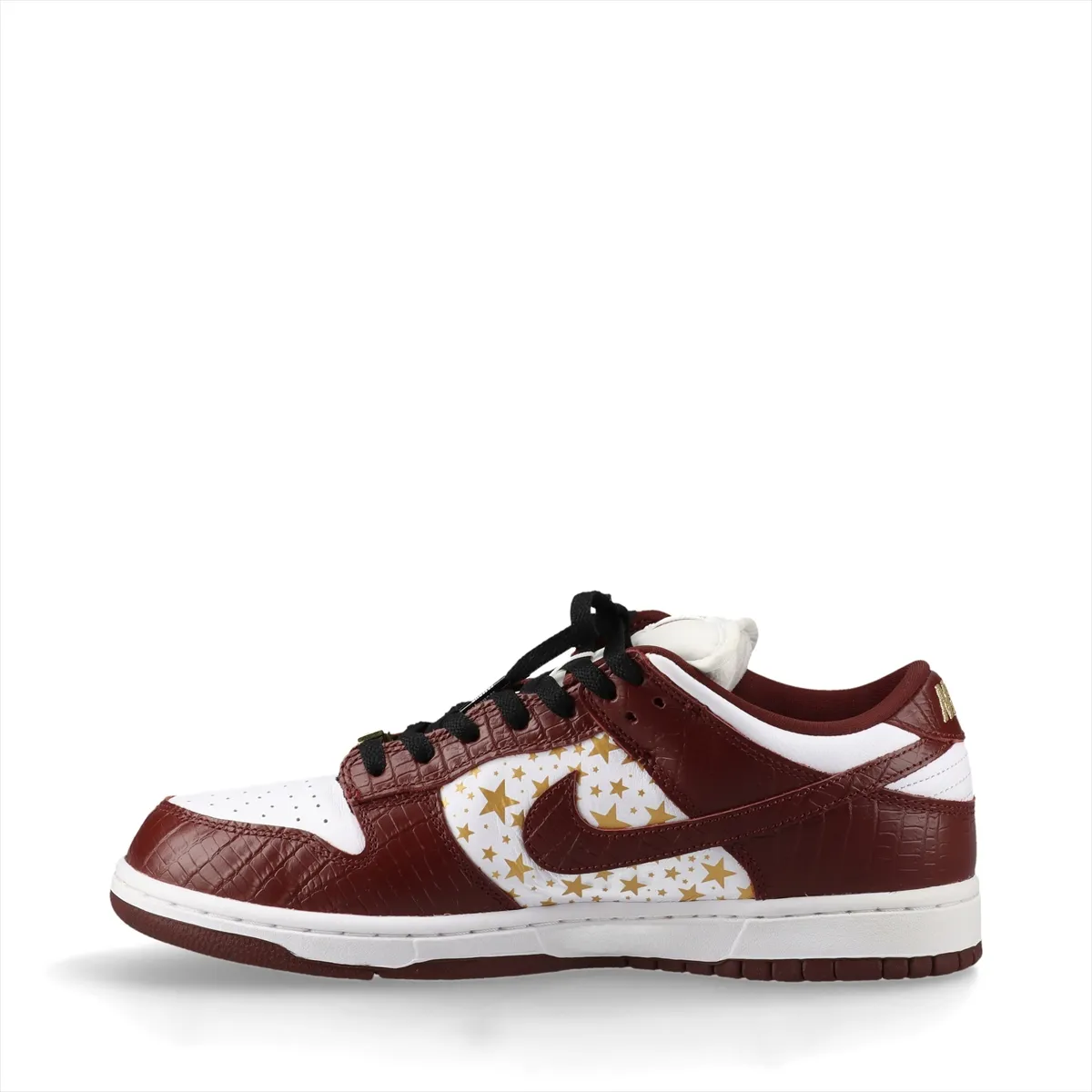 White and brown croc-textured low-top sneakers on a plain background.