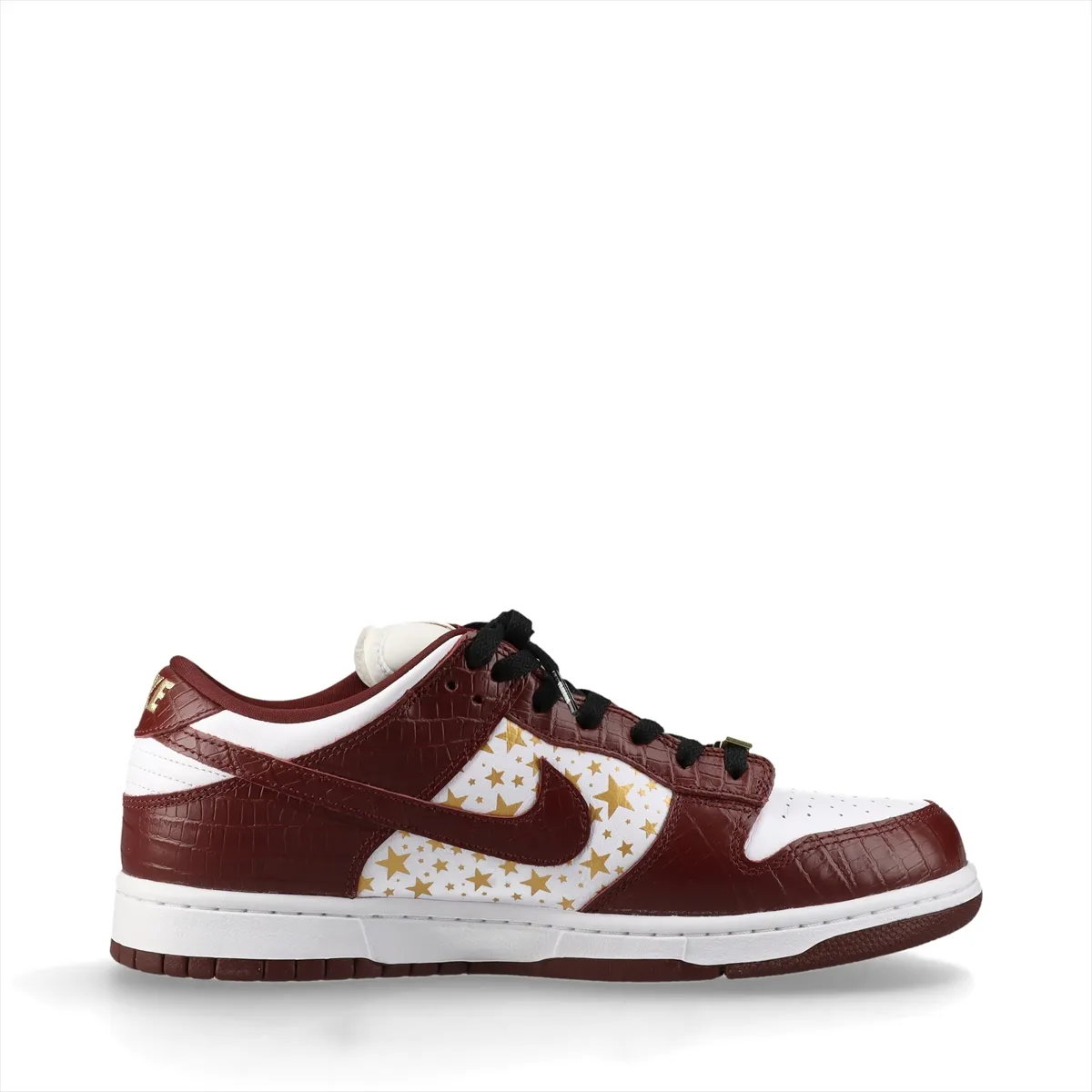White and brown croc-textured low-top sneakers on a plain background.
