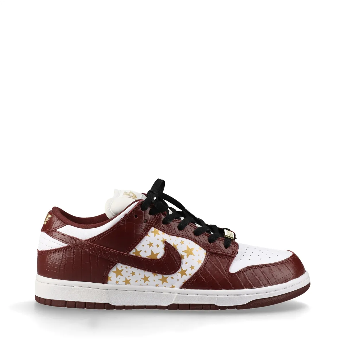 White and brown croc-textured low-top sneakers on a plain background.
