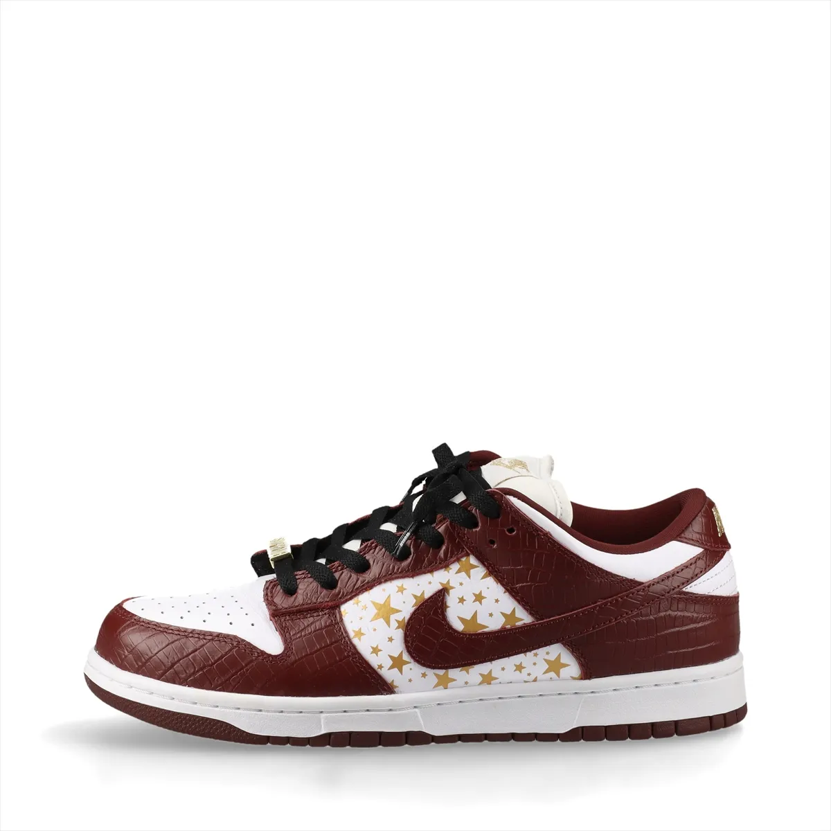 White and brown croc-textured low-top sneakers on a plain background.