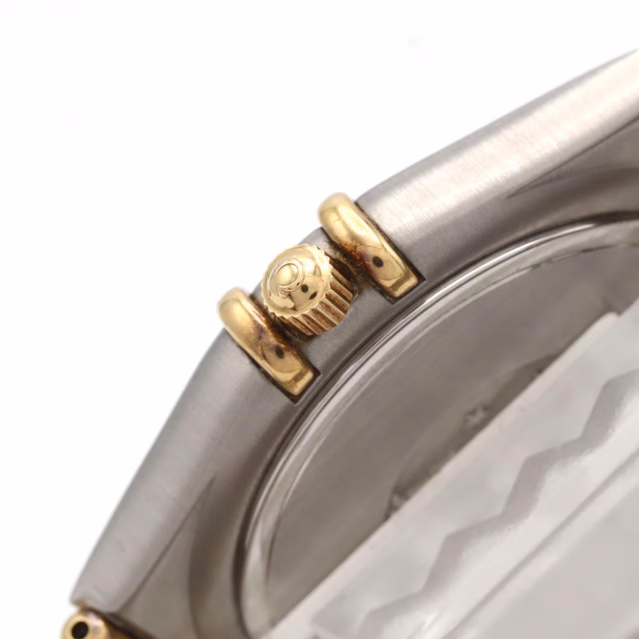 Two-tone silver and gold wristwatch with matching bracelet and a pale dial.